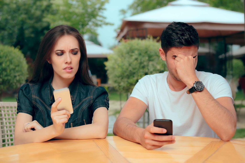 curious girlfriend checking boyfriend phone social media cheating